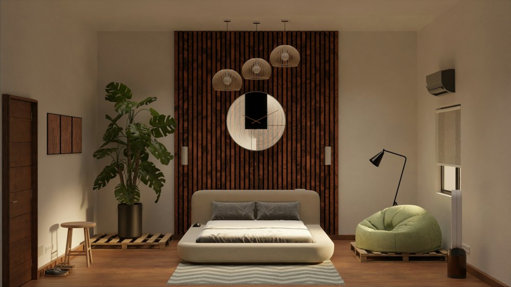 Furnished bedroom with a double bed, warm lighting and a plant