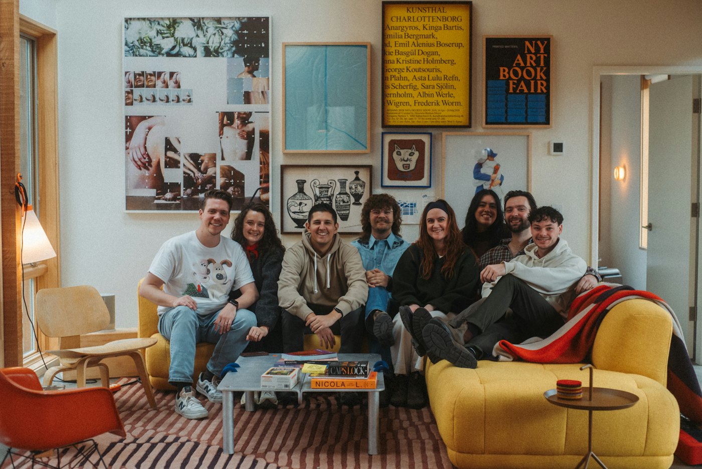 Flatmates relaxing together on a sofa in a shared apartment