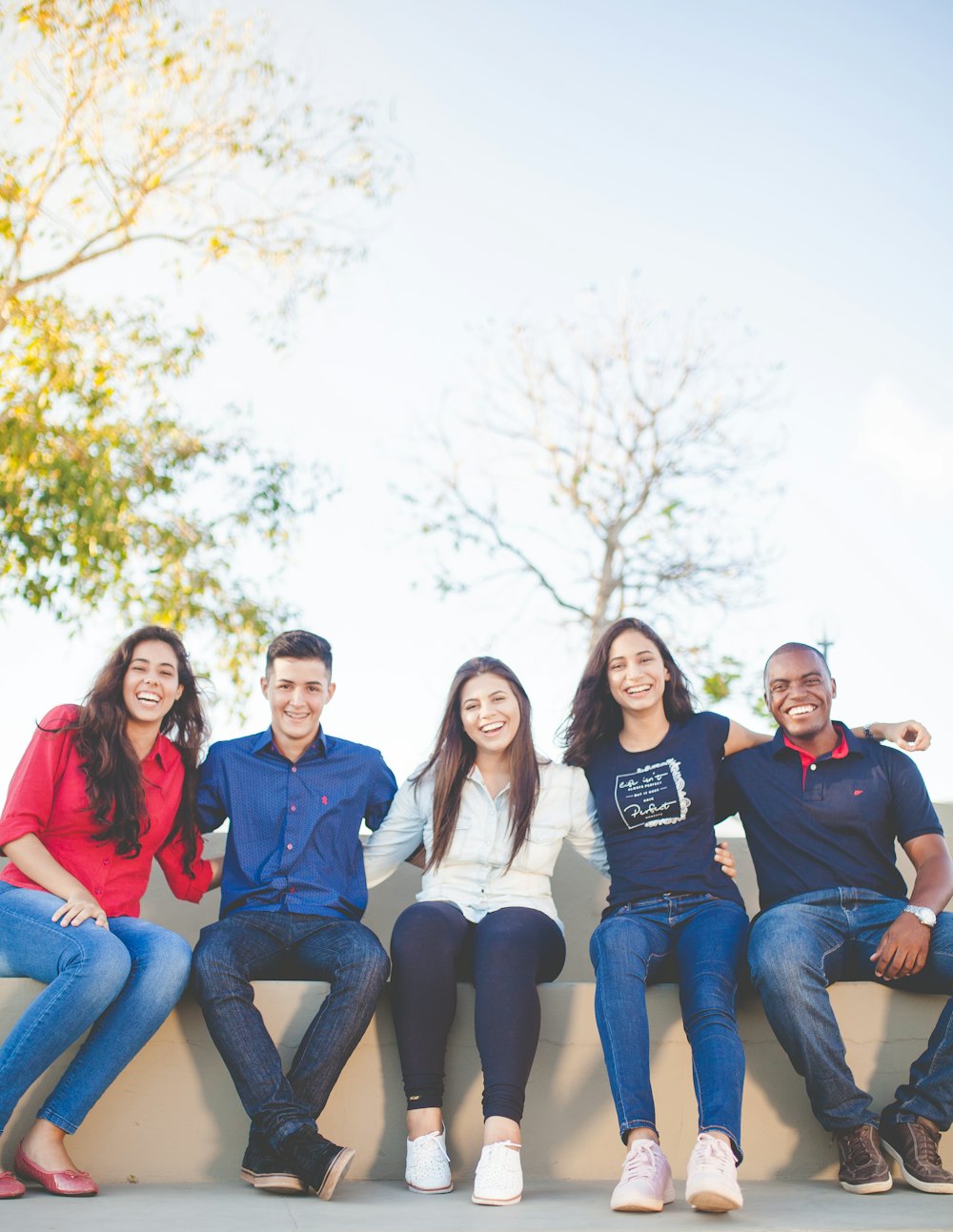 Young friends smiling together outdoors